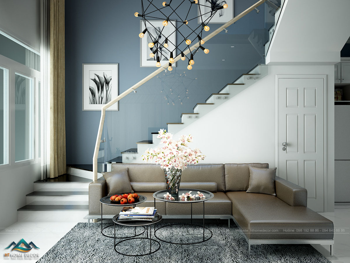 Phong cách thiết kế hiện đại và sang trọng không làm cho không gian căn phòng hẹp lại khi đặt cầu thang ngay vị trí phòng khách.