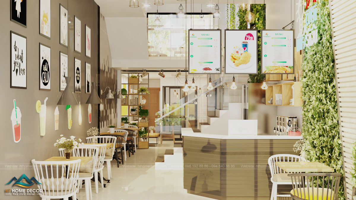 quán cafe fastfood Có thể thấy màu trắng được chọn làm tông màu chính cho không gian. Những bức tranh tối giản, cùng với vài sticker ly nước đã góp phần làm cho bức tường xám không quá trống trải.