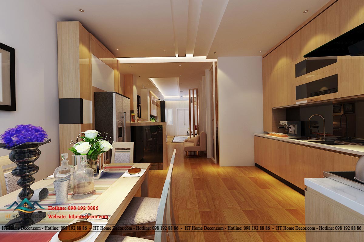 Hệ thống tủ gỗ sang trọng, với những đường nét tinh tế sang trọng. Từ nhà bếp có thể nhìn thông ra được phòng khách.